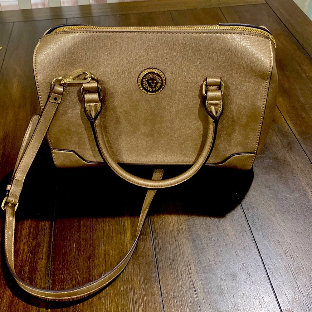 Anne Klein purse golden colored in excellent condition! No rips, tears or odors